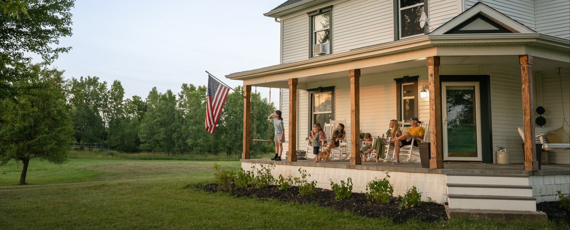American family sitting on their porch