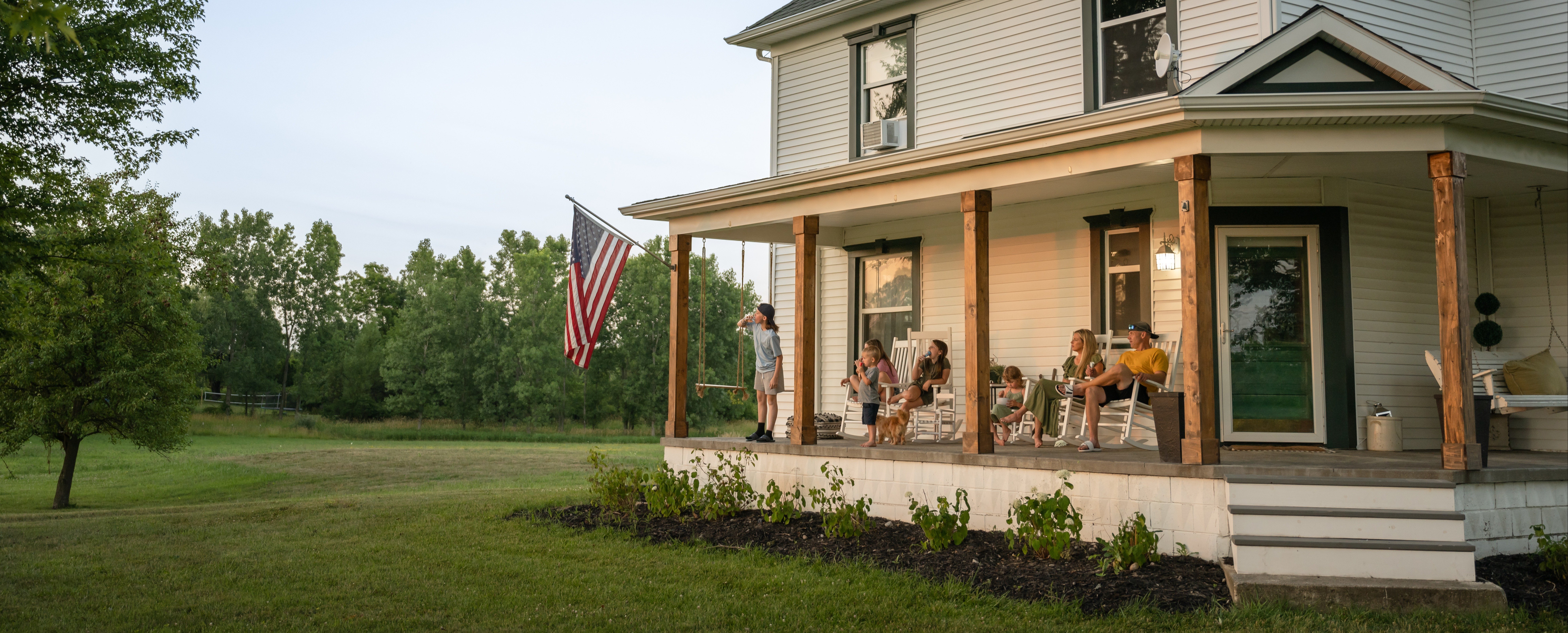 American family sitting on their porch